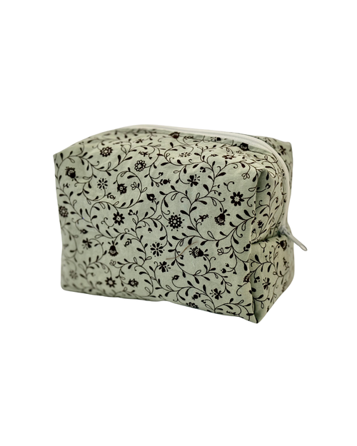 pale blue and brown Floral-patterned toiletry pouch with a white zipper on a white background 