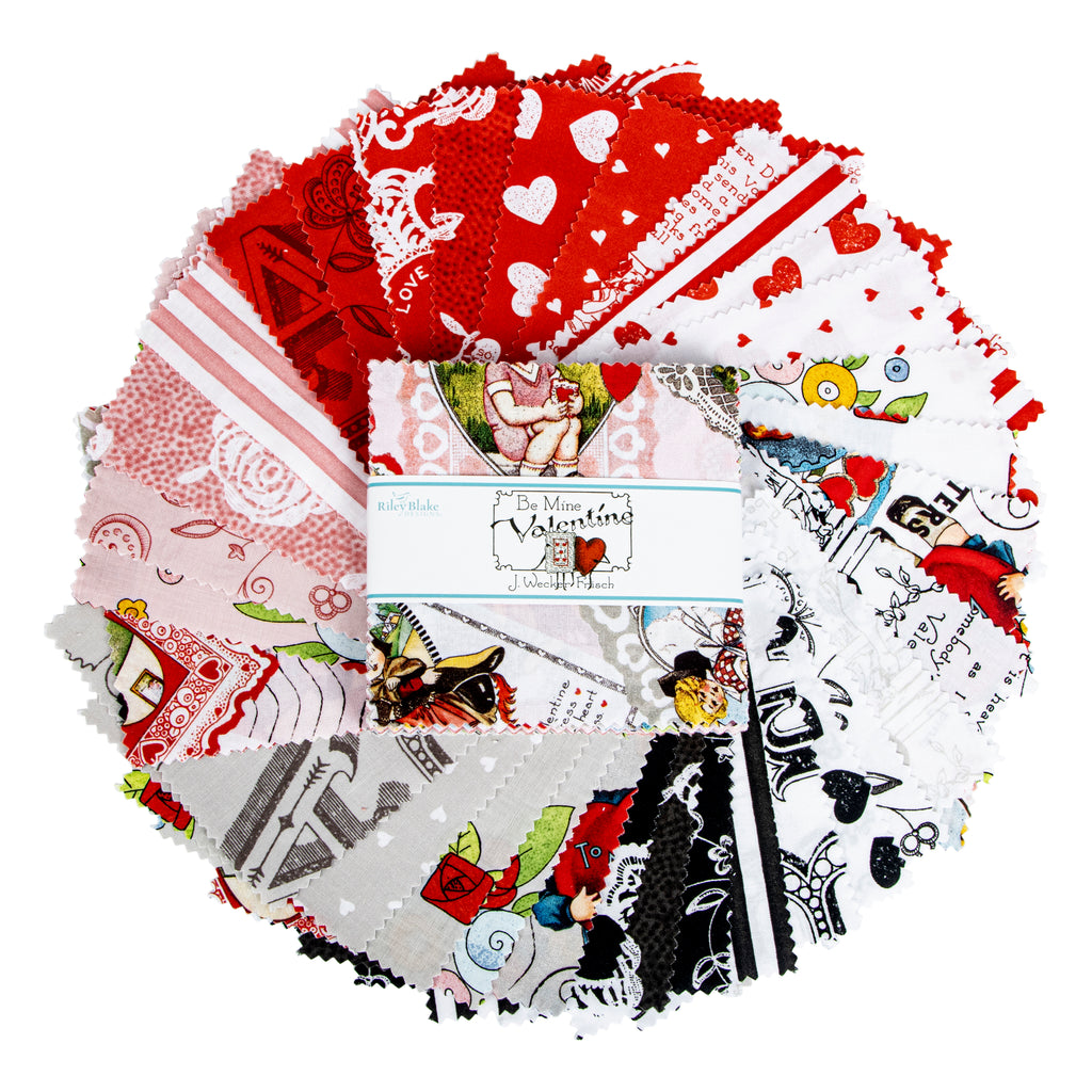 A circular stack of small patterned fabric swatches with a central paper label reading 'Be Mine Valentine' showing assorted red, white, black, gray, and floral prints.