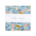 A 5 in fabric stack with a floral pattern on a light blue background, wrapped in a white paper band labeled 'Riley Blake Fabrics' and 'Petals & Hazel'.