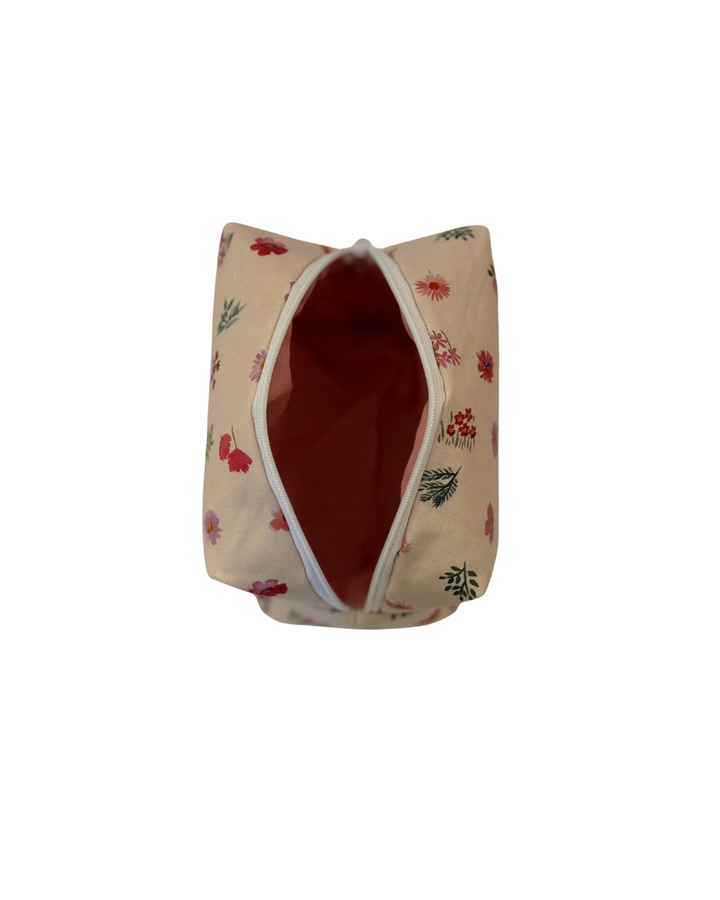 pink Floral-patterned cosmetic bag with a open white zipper on a light background