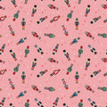 Pattern of colorful nutcrackers on a pink background