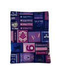 Purple and blue patterned e-reader sleeve with cat-themed text and graphics on a white background
