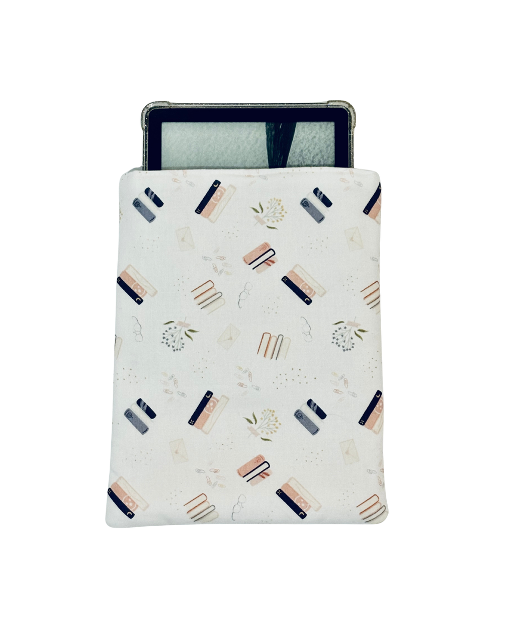 kindle inside white, pink, and blue e-reader case with a pattern containing florals and stacked books