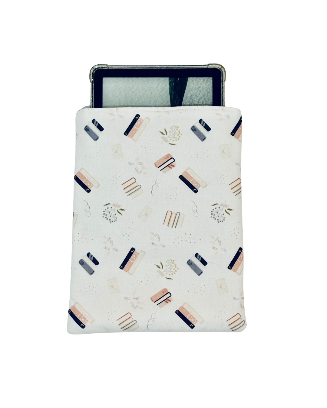 kindle inside white, pink, and blue e-reader case with a pattern containing florals and stacked books