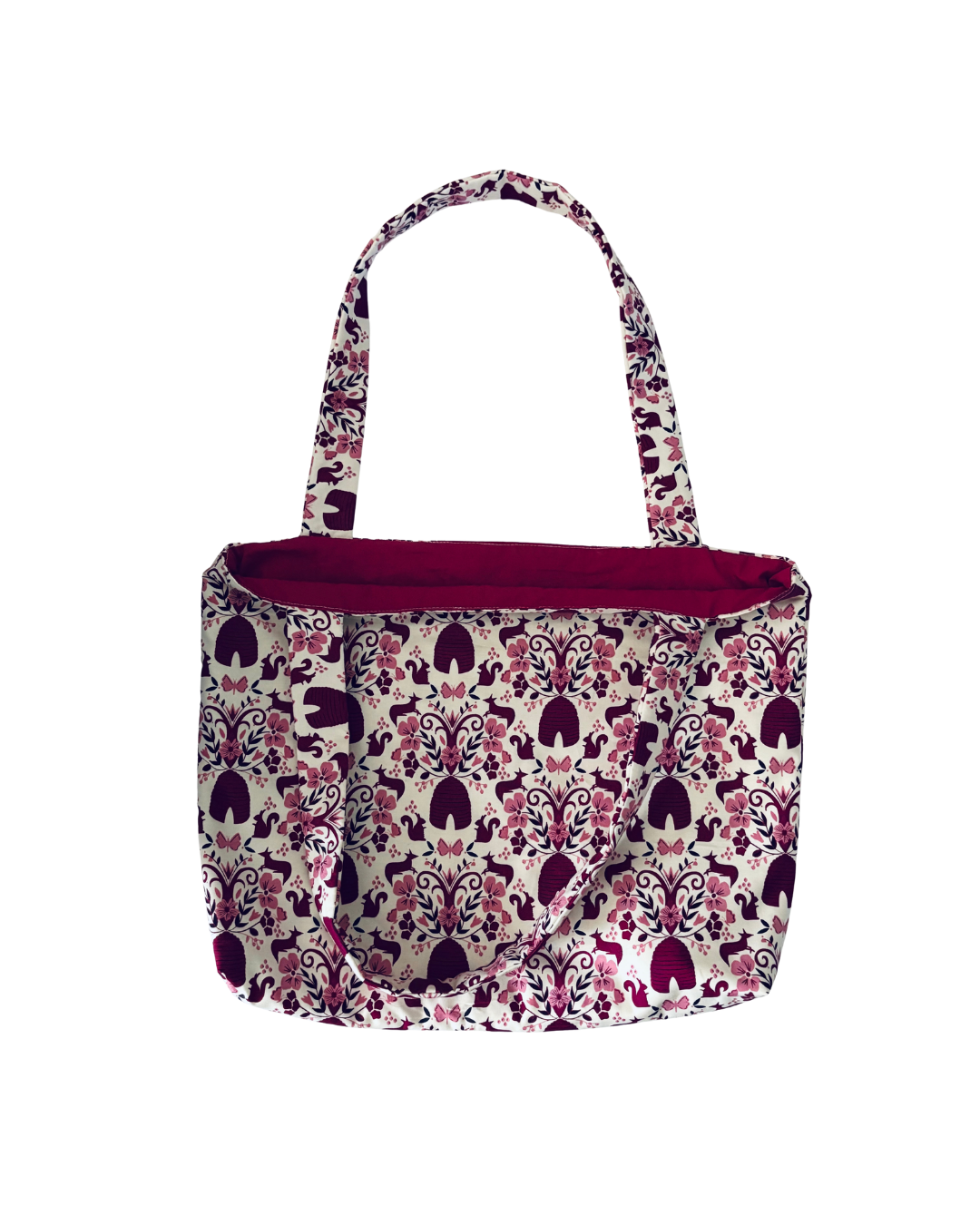 white tote bag with purple woodland print with purple interior against white background