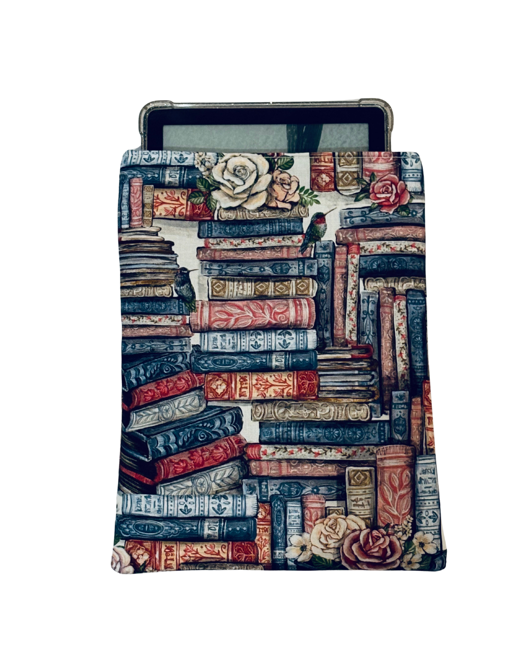 kindle inside multicolored E-reader sleeve with a design of stacked books and flowers on a white background