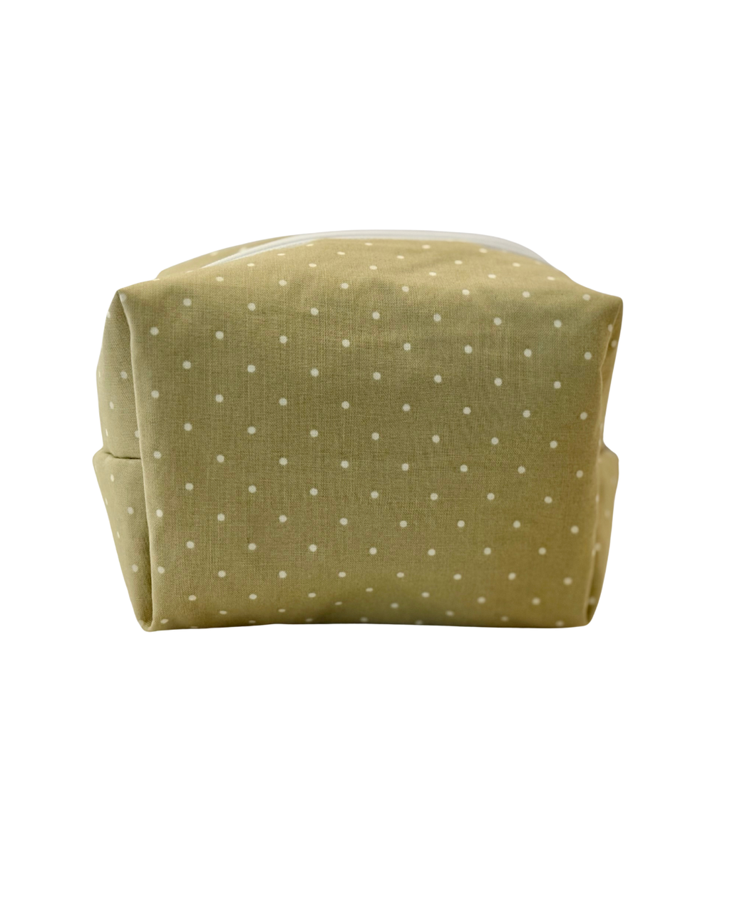 Green polka dot pouch with a white zipper on a white background