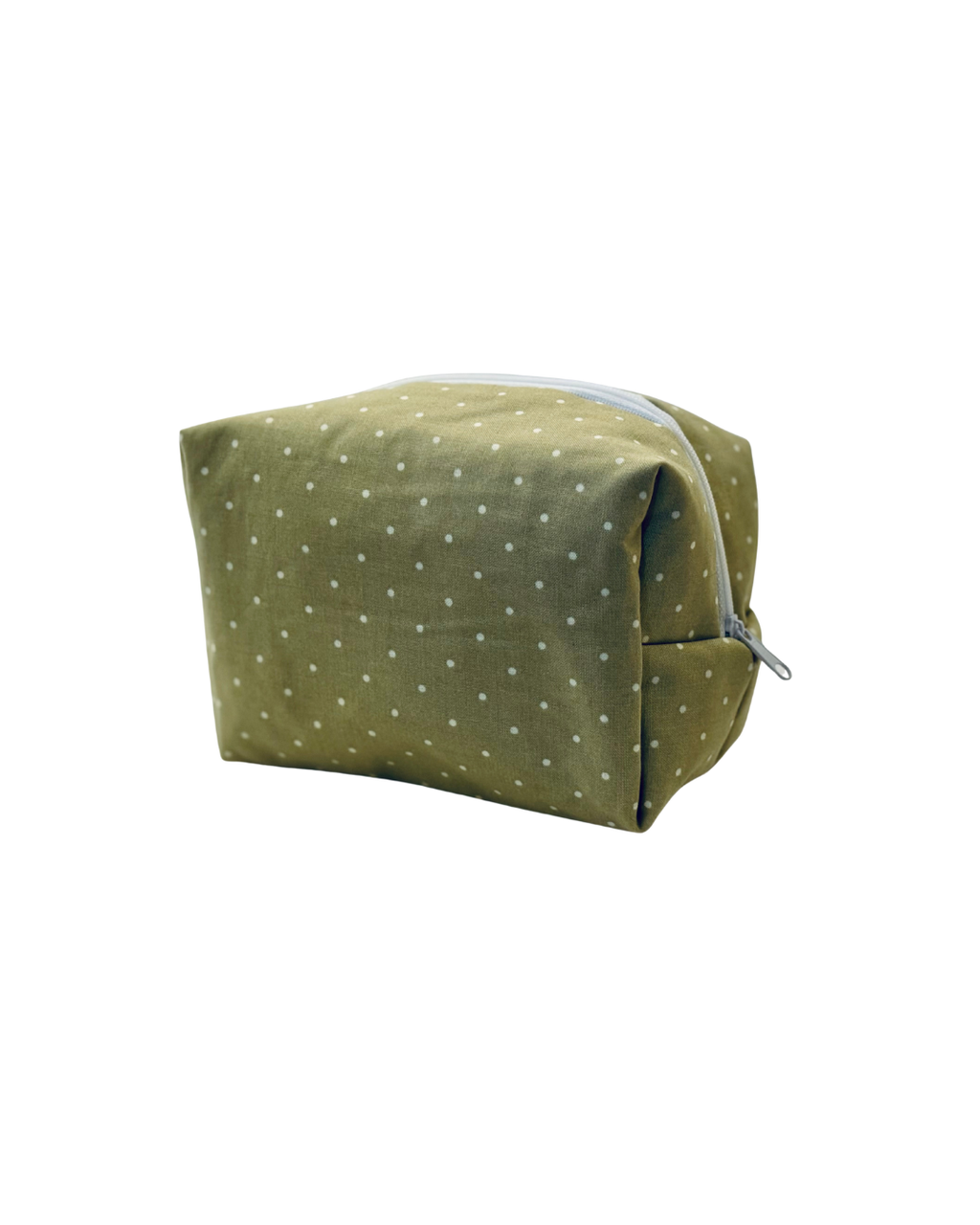 Green polka dot pouch with a white zipper on a white background