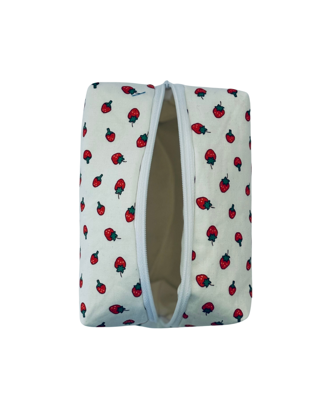 toiletry bag with white and red  strawberry pattern with open white zipper on a white background